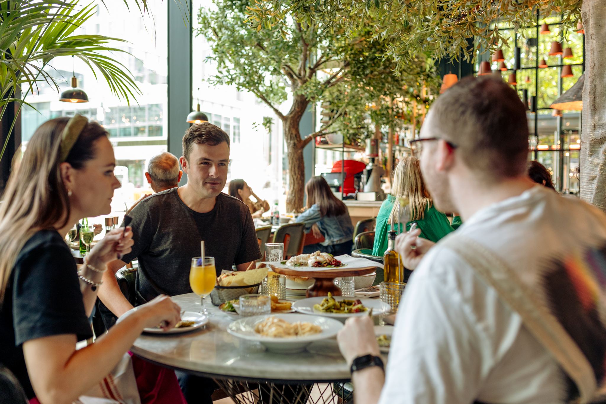 People enjoying a meal at a Stratford Cross restaurant